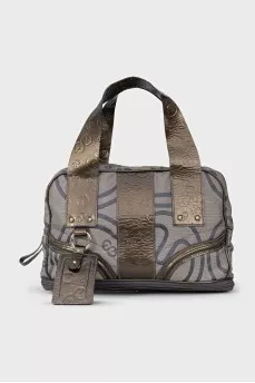 Textile bag with patent leather handles