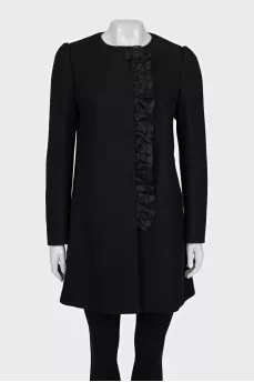 A fitted coat decorated with a frill