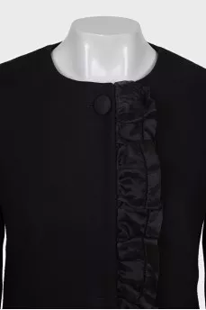 A fitted coat decorated with a frill