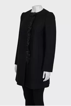 A fitted coat decorated with a frill