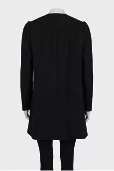 A fitted coat decorated with a frill