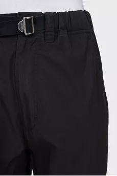 Black trousers with drawstrings on the legs