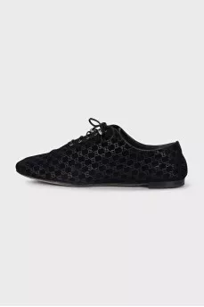 Black suede shoes with branded embossing