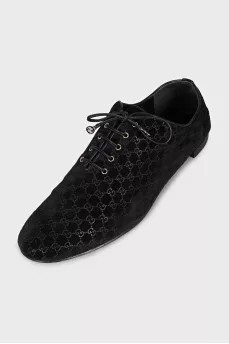 Black suede shoes with branded embossing