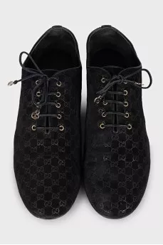 Black suede shoes with branded embossing