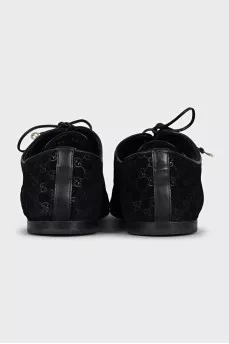 Black suede shoes with branded embossing