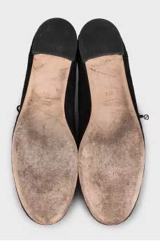 Black suede shoes with branded embossing