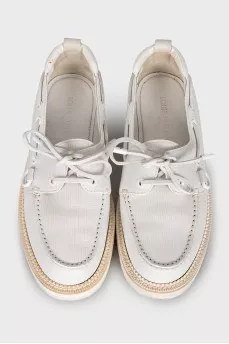 Men's leather loafers decorated with laces