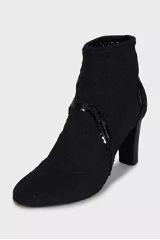 Ankle boots with perforated heels