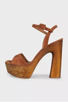 Suede sandals with a gold platform