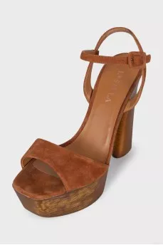Suede sandals with a gold platform