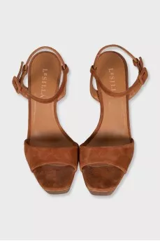 Suede sandals with a gold platform