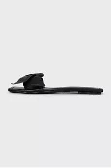Black leather flip flops with a bow