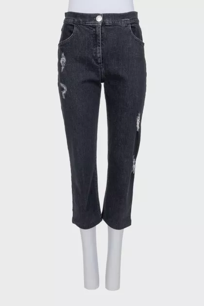 Gray capri pants with a distressed effect