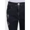 Gray capri pants with a distressed effect