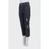 Gray capri pants with a distressed effect