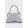Hourglass embossed leather bag