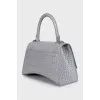 Hourglass embossed leather bag