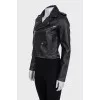 Black leather jacket with silver hardware and tag
