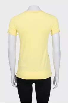 Yellow T-shirt with decoration