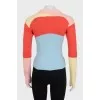Multicolored jumper with airplanes