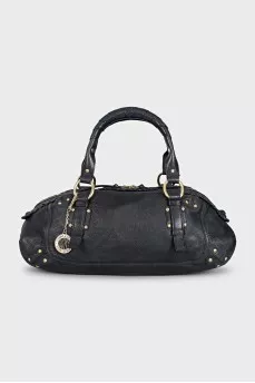 Leather bag decorated with rivets