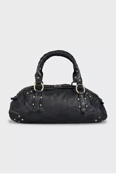 Leather bag decorated with rivets
