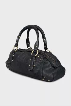 Leather bag decorated with rivets