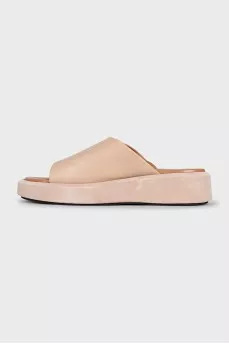 Beige leather flip-flops with high soles