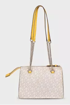 A bag with combined printed handles