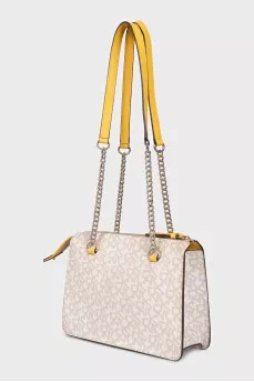 A bag with combined printed handles