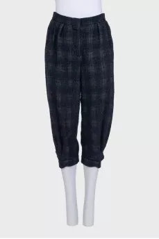 Blue tapered capri pants in a plaid print