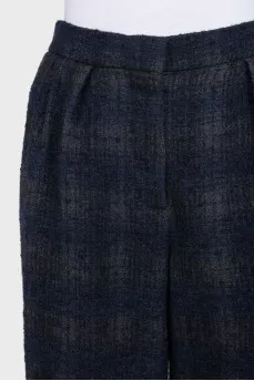 Blue tapered capri pants in a plaid print