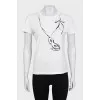 Beige T-shirt decorated with sequins