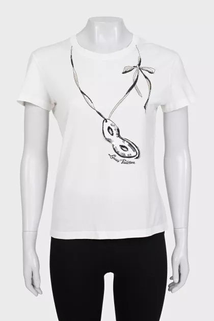 Beige T-shirt decorated with sequins