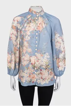 Light blue blouse with a tag