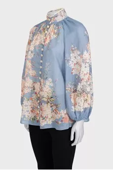 Light blue blouse with a tag