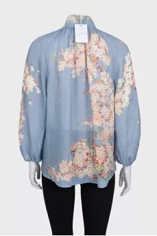 Light blue blouse with a tag