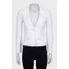White fitted jacket with a button