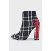 Checkered ankle boots with heels and embroidered details
