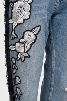 Blue jeans with fringe and embroidery