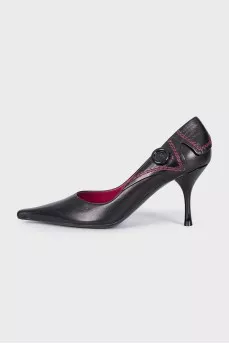 Black leather shoes with a button