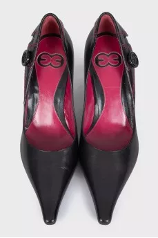 Black leather shoes with a button
