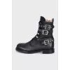 Leather boots decorated with straps