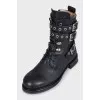 Leather boots decorated with straps