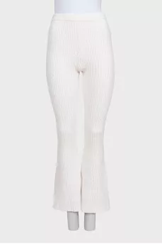 White suit with trousers, a top and a cardigan