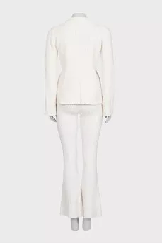 White suit with trousers, a top and a cardigan