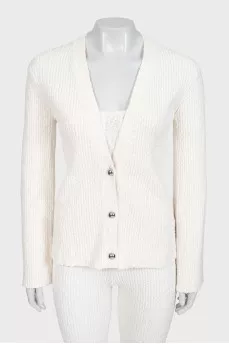 White suit with trousers, a top and a cardigan