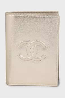 Gold-tone wallet with signature embossing