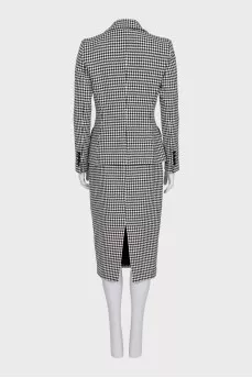 A suit consisting of a jacket, dress, and printed skirt